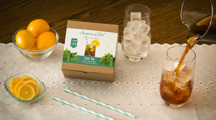 Moroccan Mint Iced Teabags Box with lemons and brewed iced tea