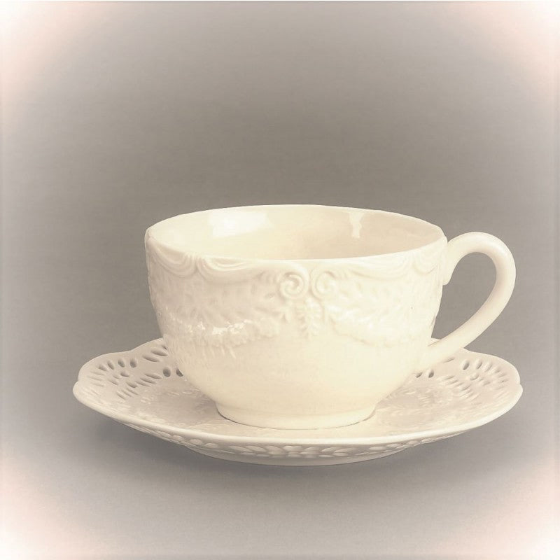 Cream colored Victorian cup & saucer