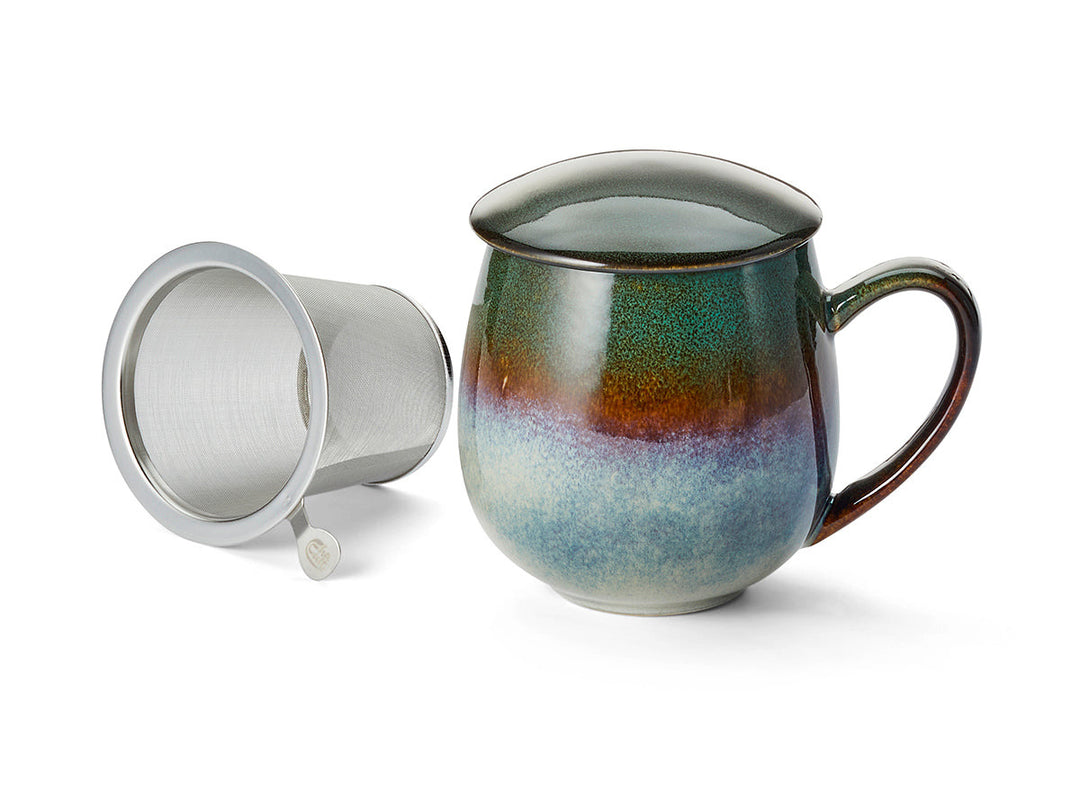 Multicolored ceramic mug with a metal filter on a white background