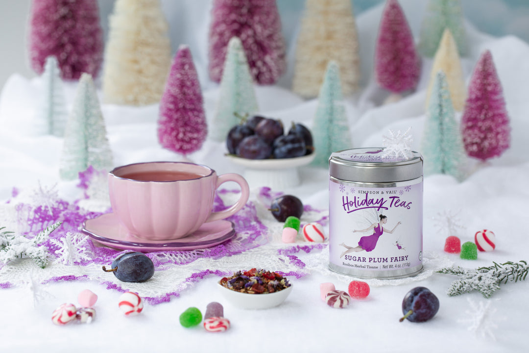 sugar plum fairy tea with brewed tea , candy and plums