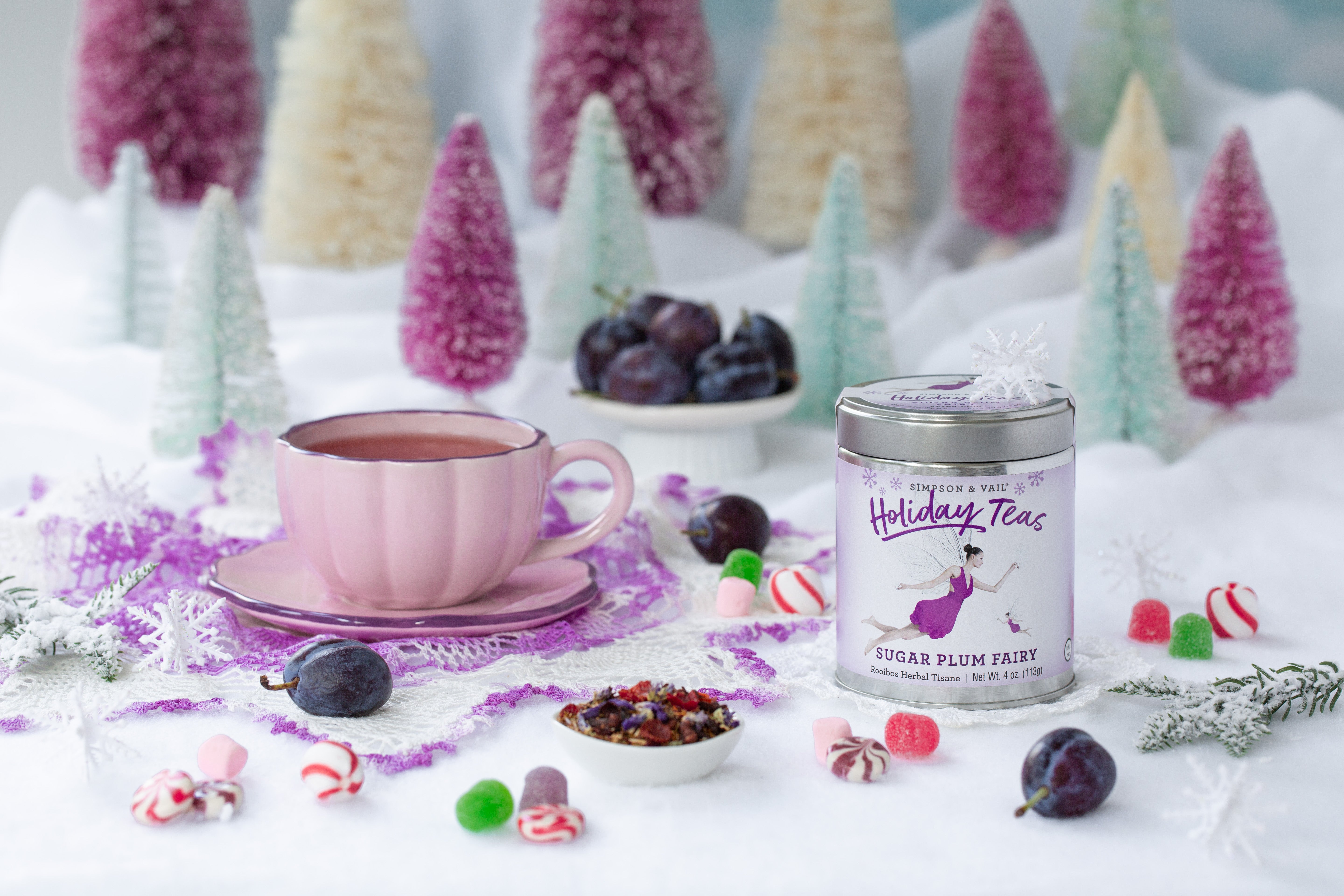 sugar plum fairy tea with brewed tea , candy and plums